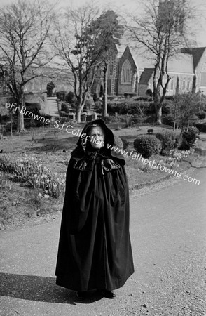 HOODED CLOAK ( MRS O'LEARY ) AT PAROCHIAL HOUSE